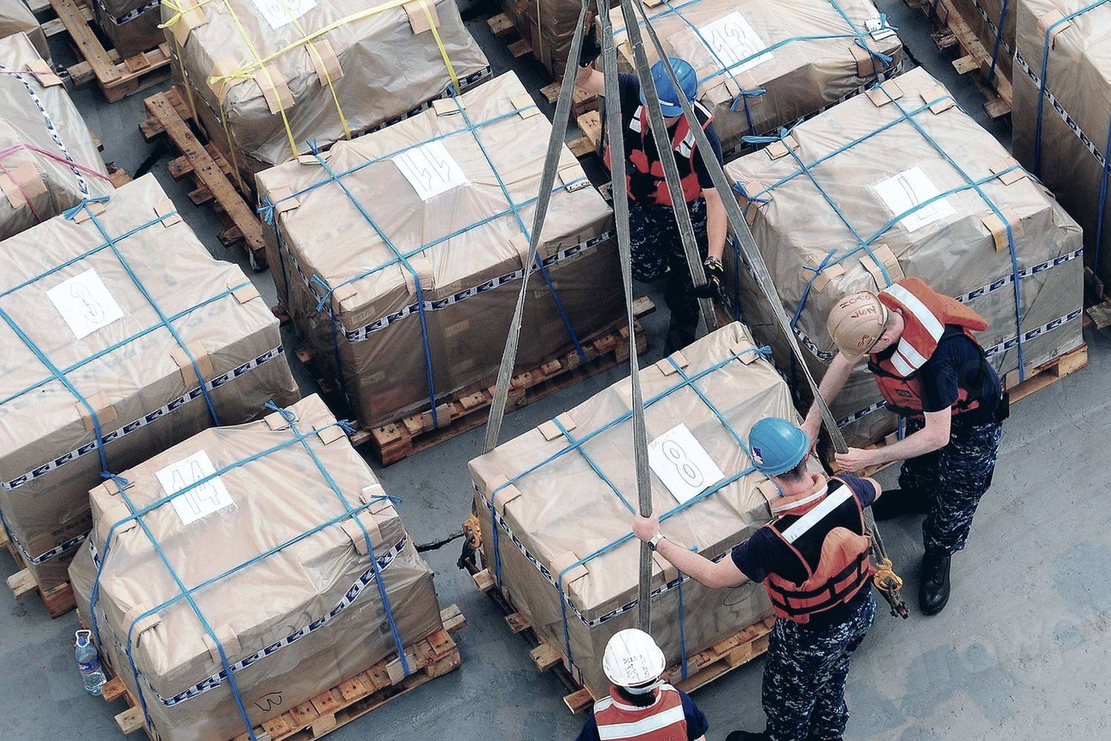 Palletised and strapped project cargo being handled