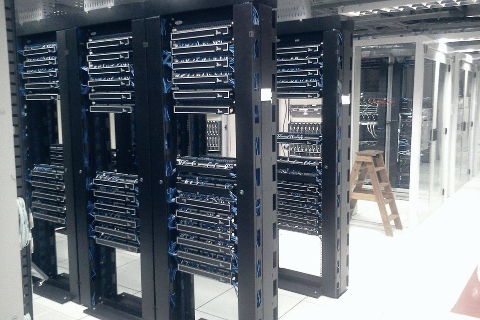 Rows of rack-mounted servers in a data hall