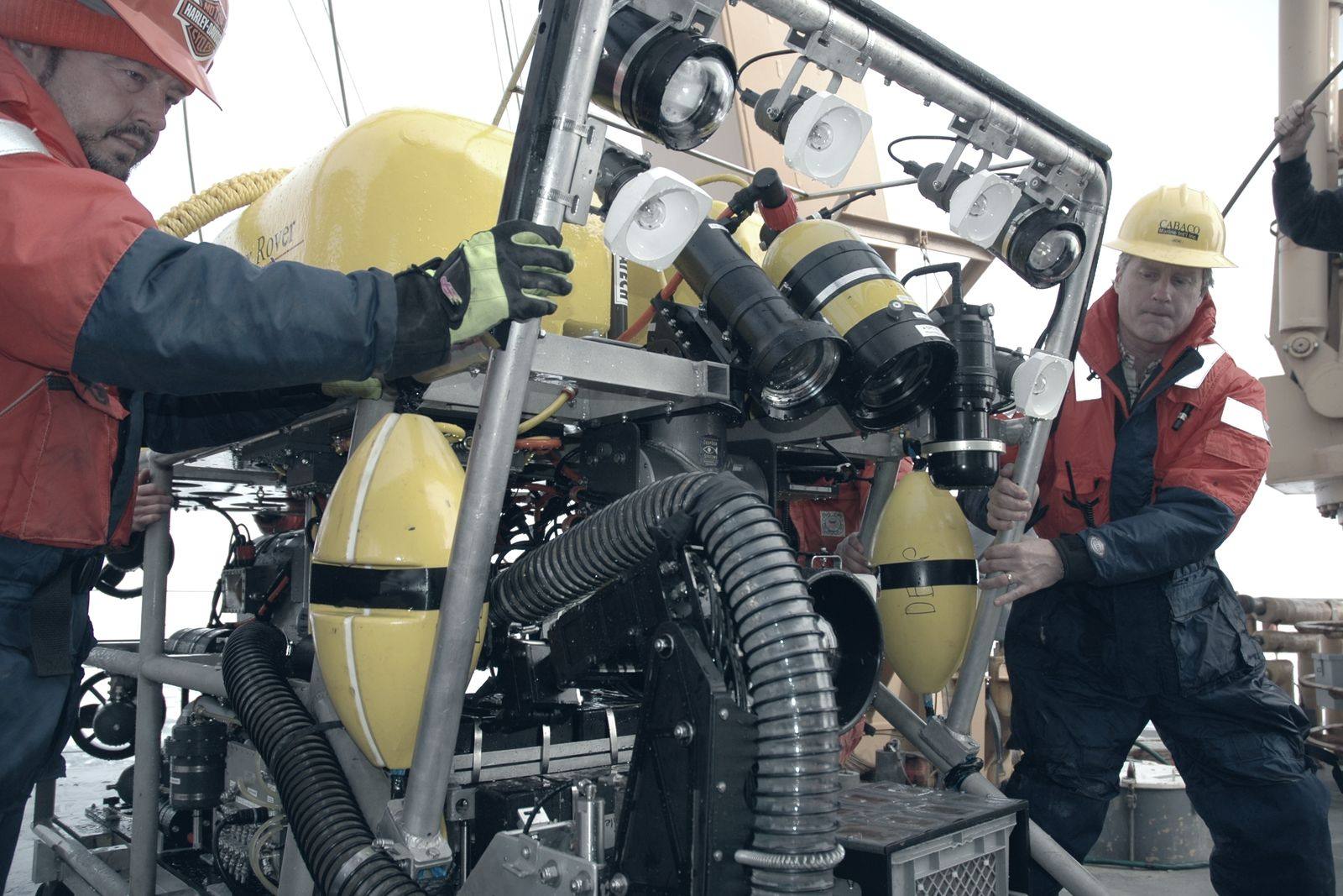 Technicians preparing a remotely operated vehicle